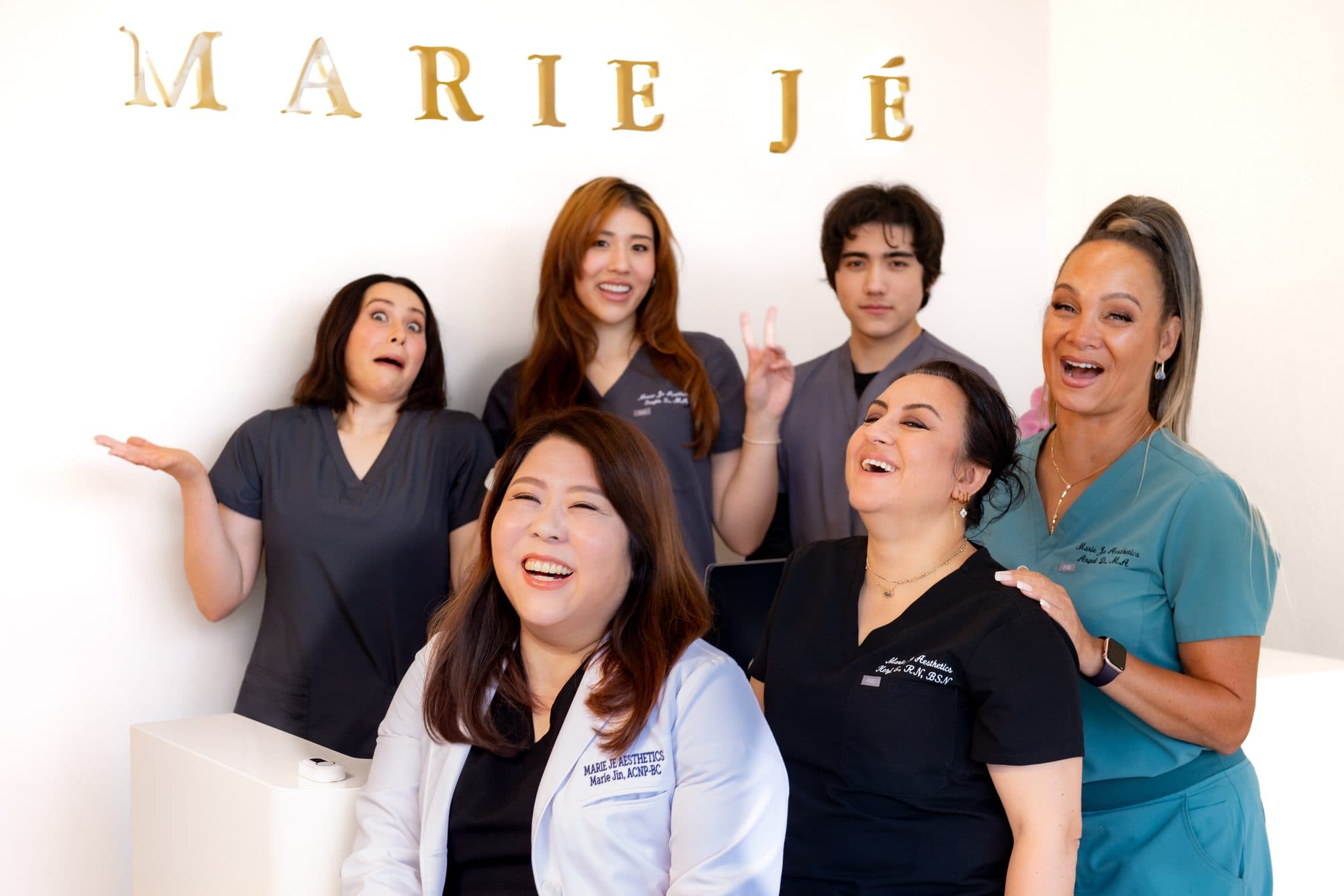 The Marie Jé Aesthetics team laughing together in the studio